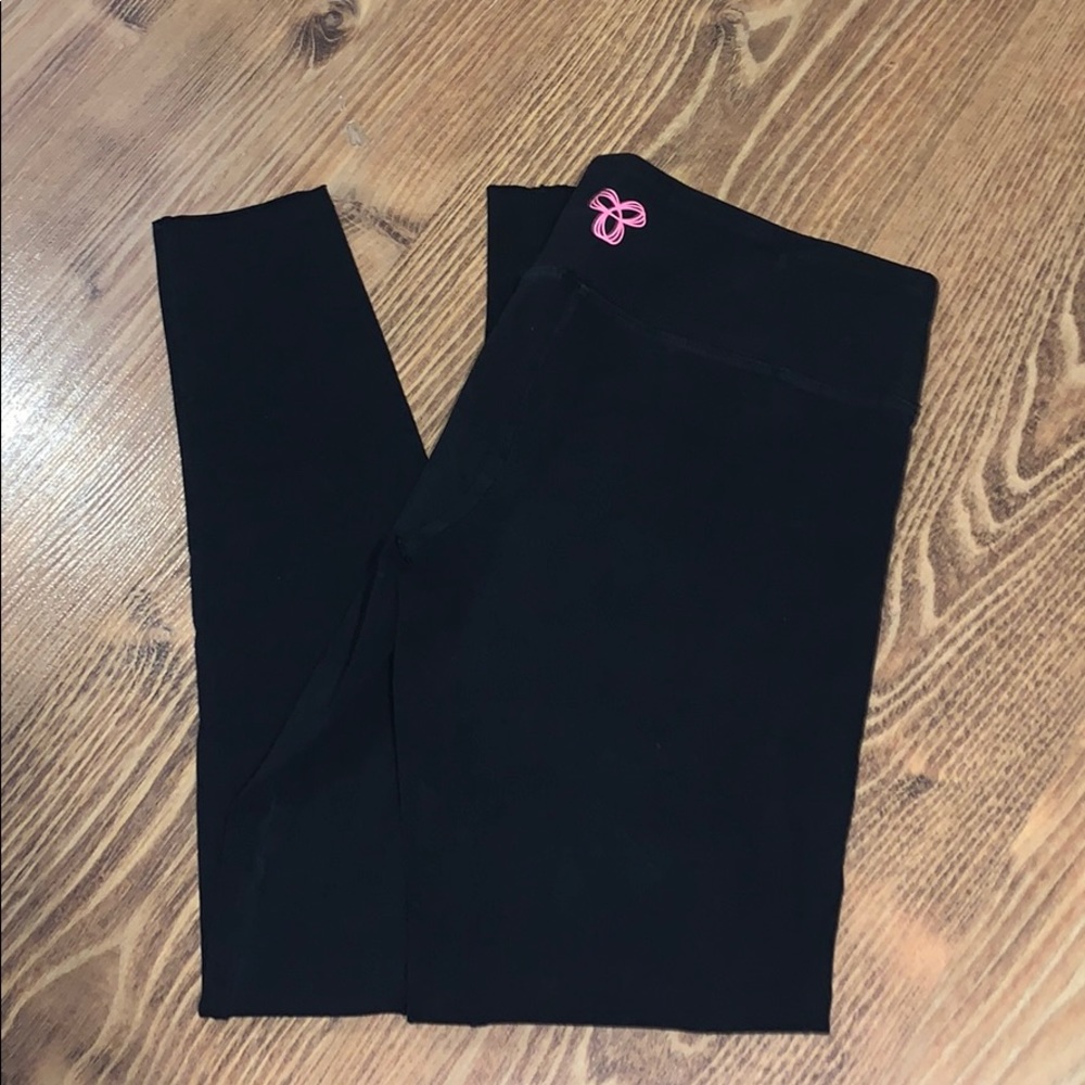 Black TNA leggings with pink logo